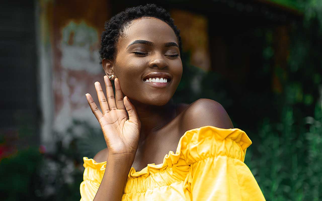 Our Story, healthy joyful woman in a yellow dress